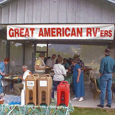 Great American RV'ers enjoying outdoor activities at Riverbend RV Park in the North Cascades, surrounded by nature and RVs.